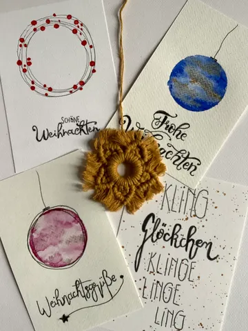Four Christmas cards with handwritten messages.