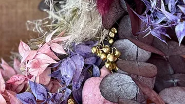 Colorful dried flowers arranged together closely.