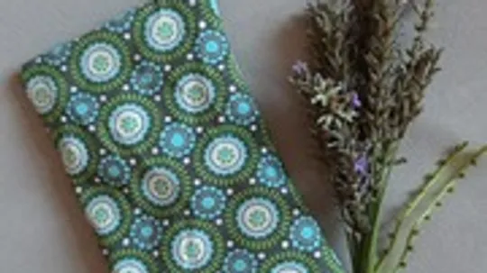 Patterned fabric next to lavender sprigs.