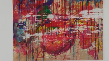 Colorful abstract painting with drips and splashes.