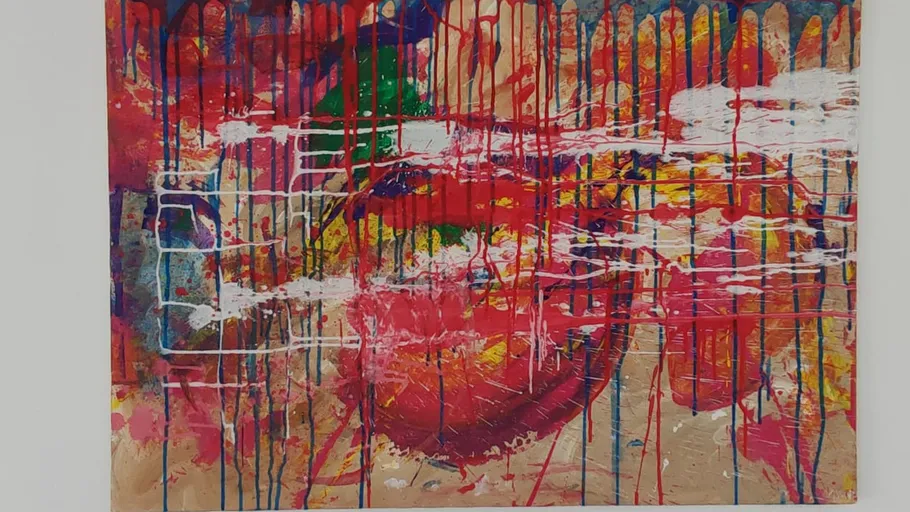 Colorful abstract painting with drips and splashes.