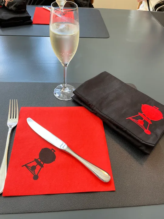 Champagne glass on a restaurant table setting.