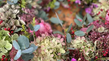 Colorful flowers and leaves arranged together.