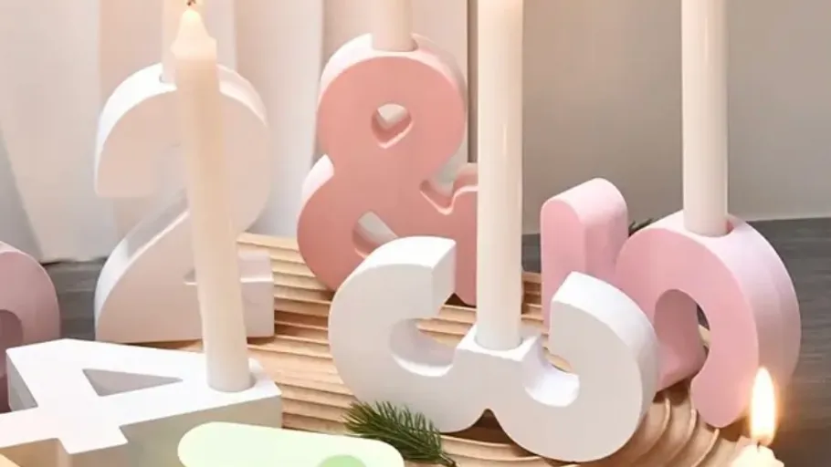 Number-shaped candles on wooden platform.