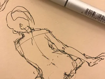 Sketch of a seated figure on brown paper.