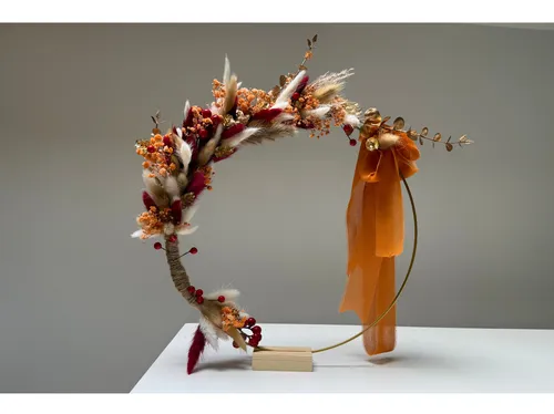 Decorative floral arrangement on a metal stand.