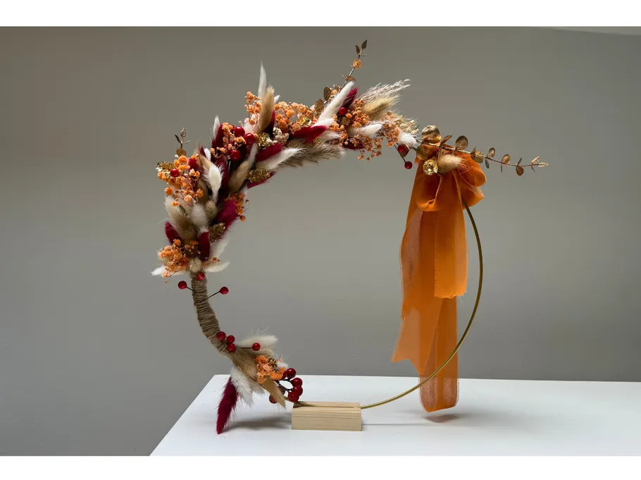 Decorative floral arrangement on a metal stand.