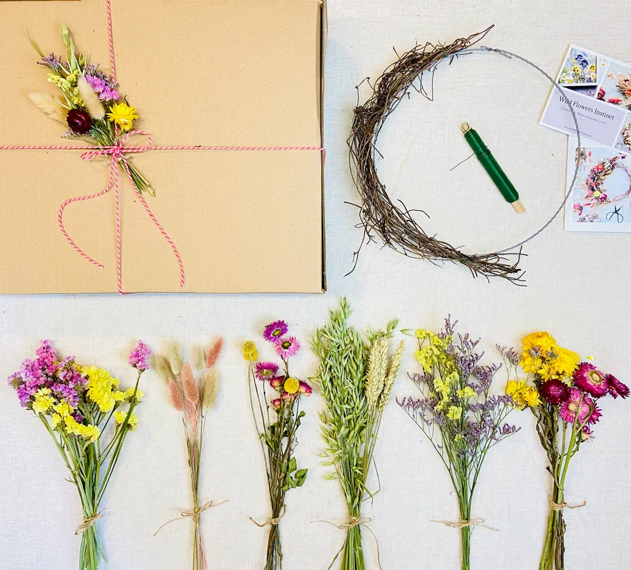 Dried flower wreath kit arranged on table.