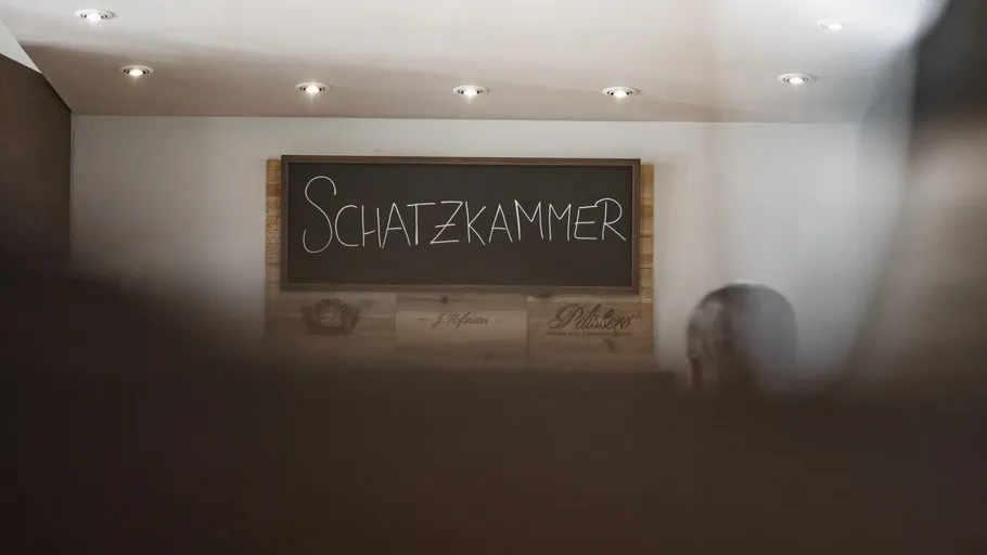 Sign with 'Schatzkammer' in modern interior.