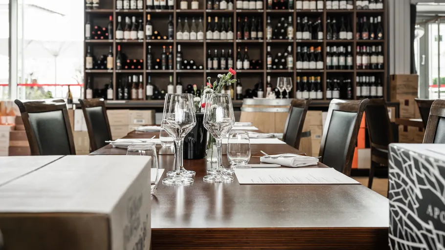 Set dining table in wine bar setting.
