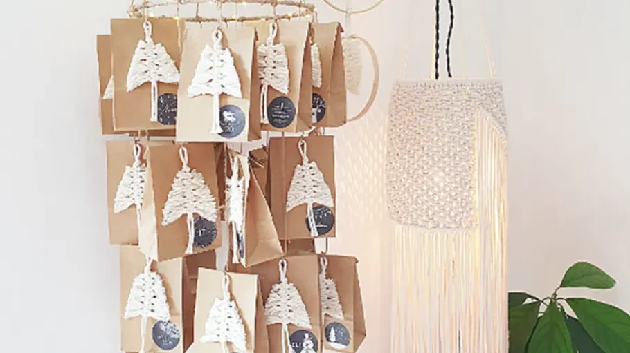 Hanging advent calendar with paper bags.