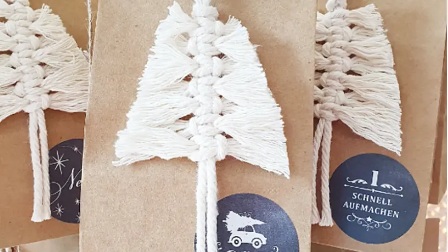 White macrame trees on brown packages.