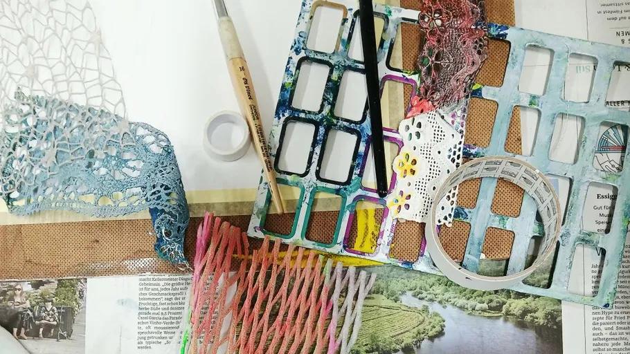 Crafting materials and tools on a table.