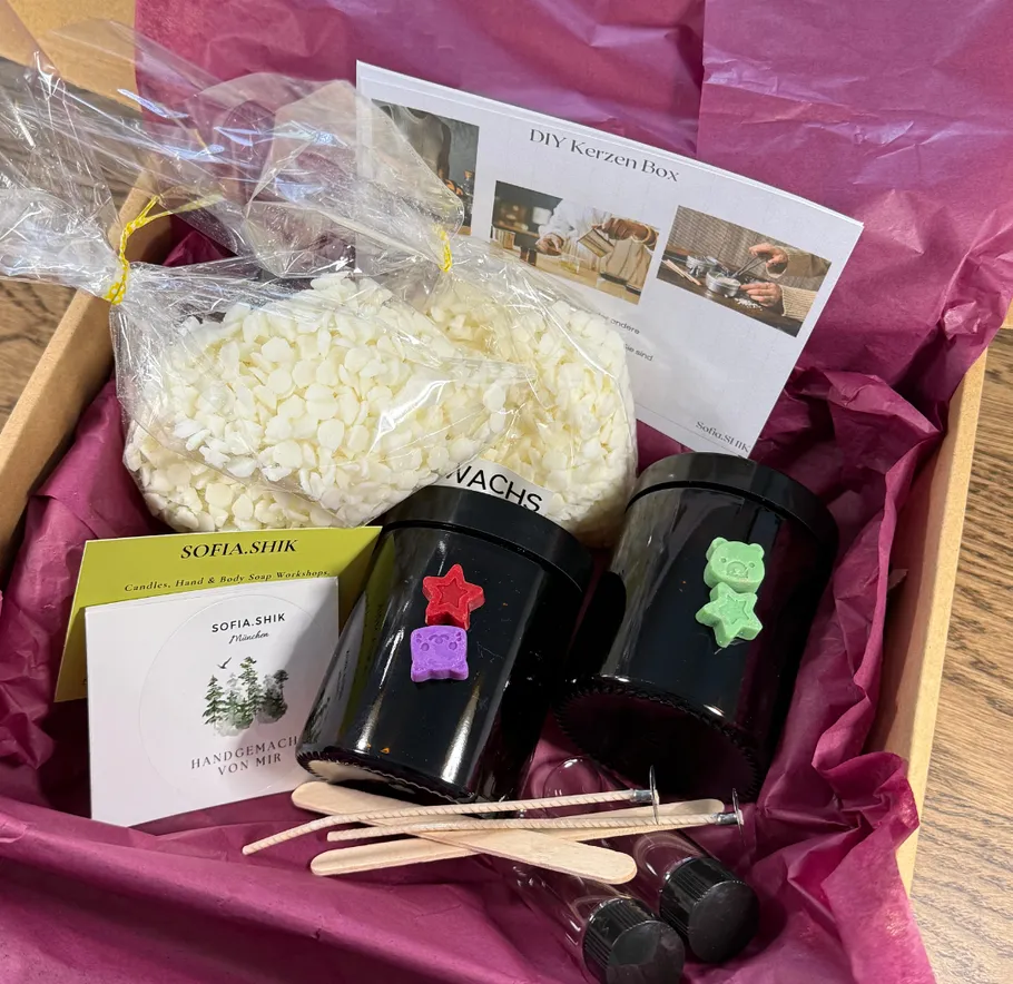 Candle making kit with wax, jars, instructions.