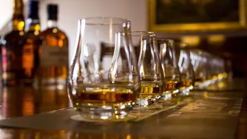 Whiskey tasting setup with glasses on table.