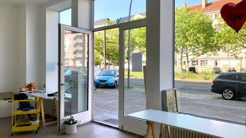 Open door in bright, modern interior space.