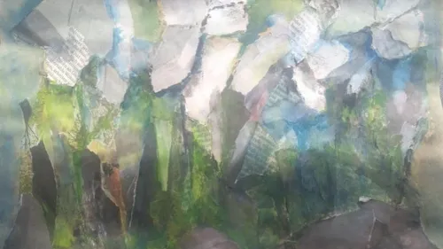 Abstract collage with various torn paper pieces.