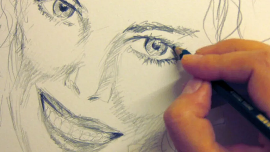Hand sketching a smiling face with pencil.