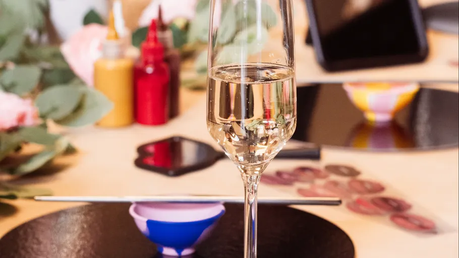 Champagne glass on a decorated dining table.