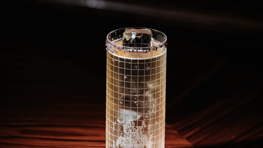 Tall glass with ice and sugar rimmed.