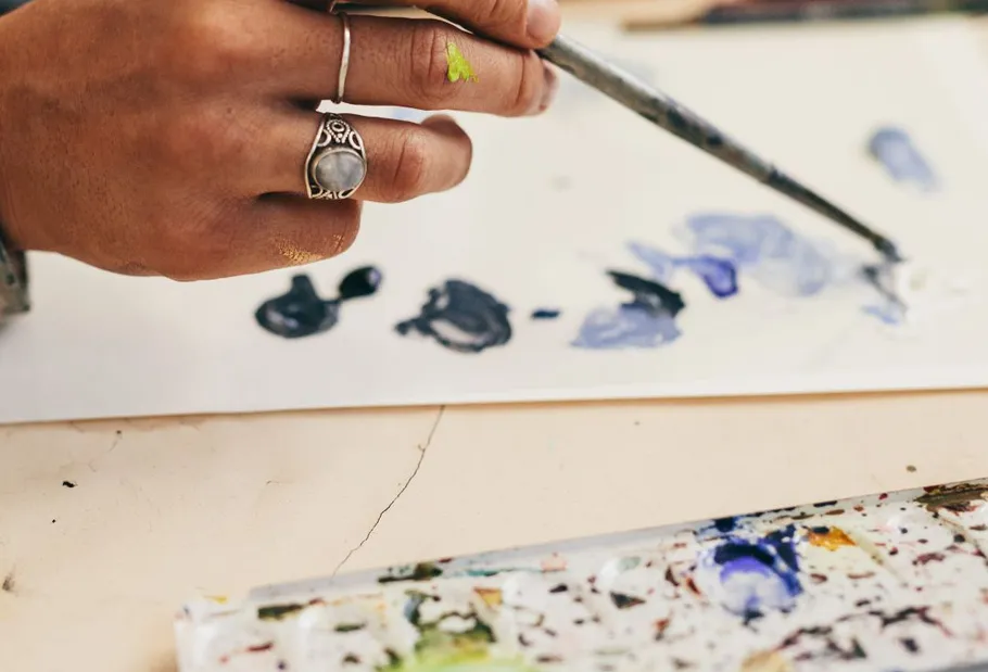 Hand painting on canvas with brush.