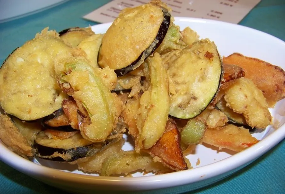 Fried vegetables in a white dish.