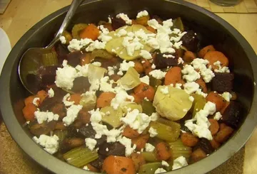 Dish of roasted vegetables topped with feta cheese.