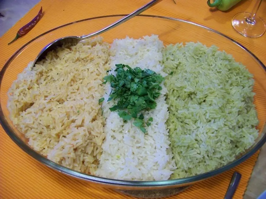 Three rice varieties in glass dish.