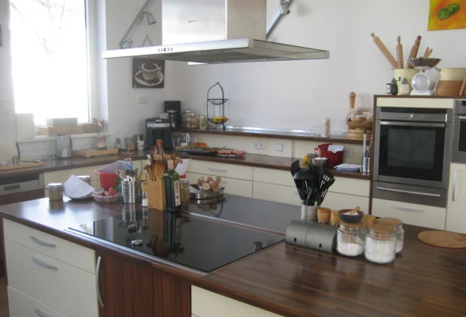 Modern kitchen with island and appliances.