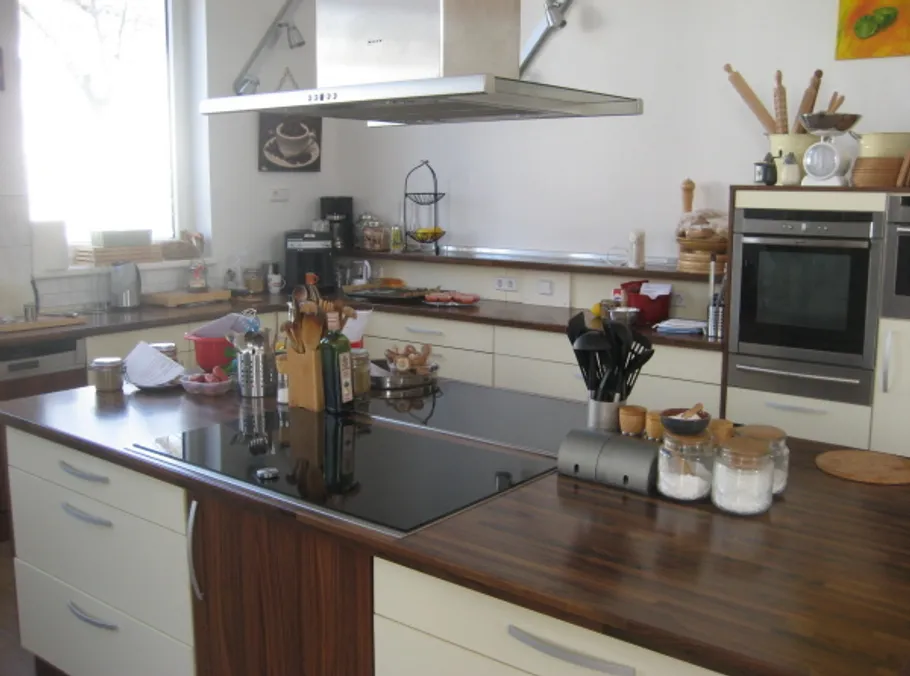 Modern kitchen with island and appliances.
