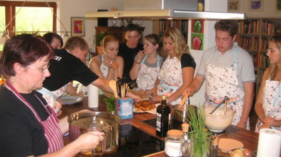 Group cooking class in a kitchen.