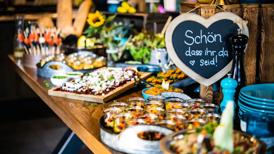 Buffet table with various food items displayed.