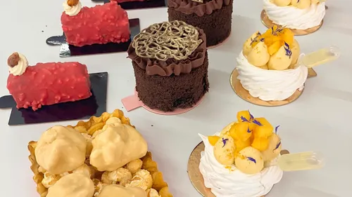 Assorted desserts on a white surface.