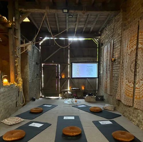 Yoga mats with cushions in rustic studio setting.