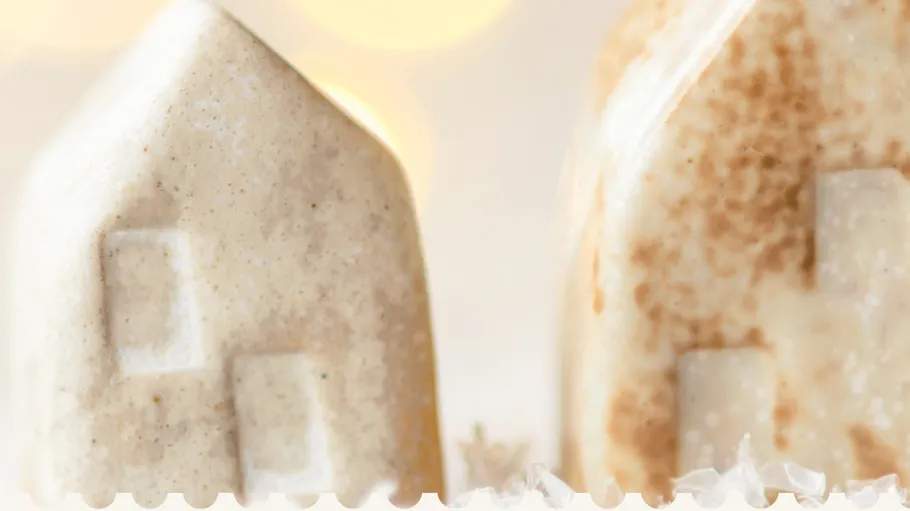 Ceramic houses with bokeh lights background.