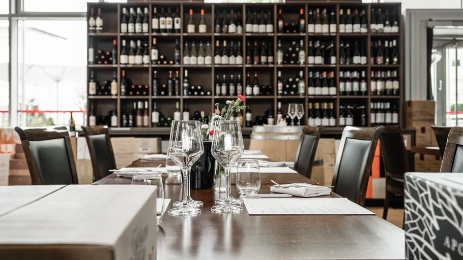 Dining table with wine glasses in winery.