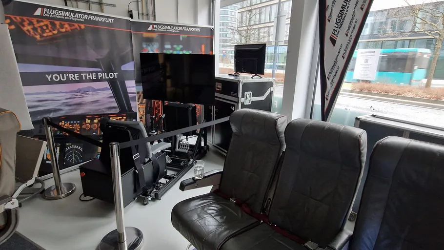 Flight simulator setup in a modern room.