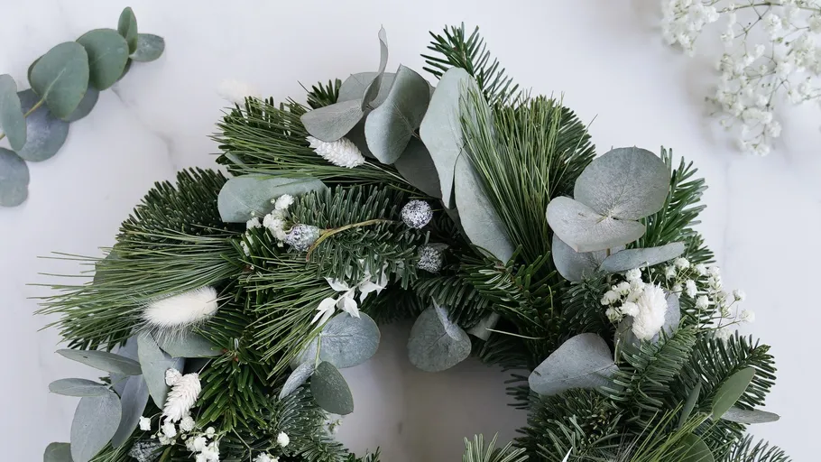 Green wreath with eucalyptus on white background.