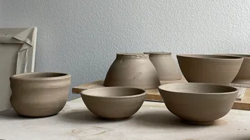 Clay bowls and pots on a table.