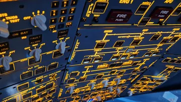 Illuminated airplane cockpit control panel.
