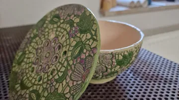 Decorative ceramic bowl with intricate pattern.