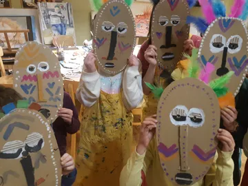 Kids keep homemade masks in a creative space.