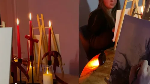 Kunstworkshop mit Staffeleien und Kerzen, Malen im Gange.