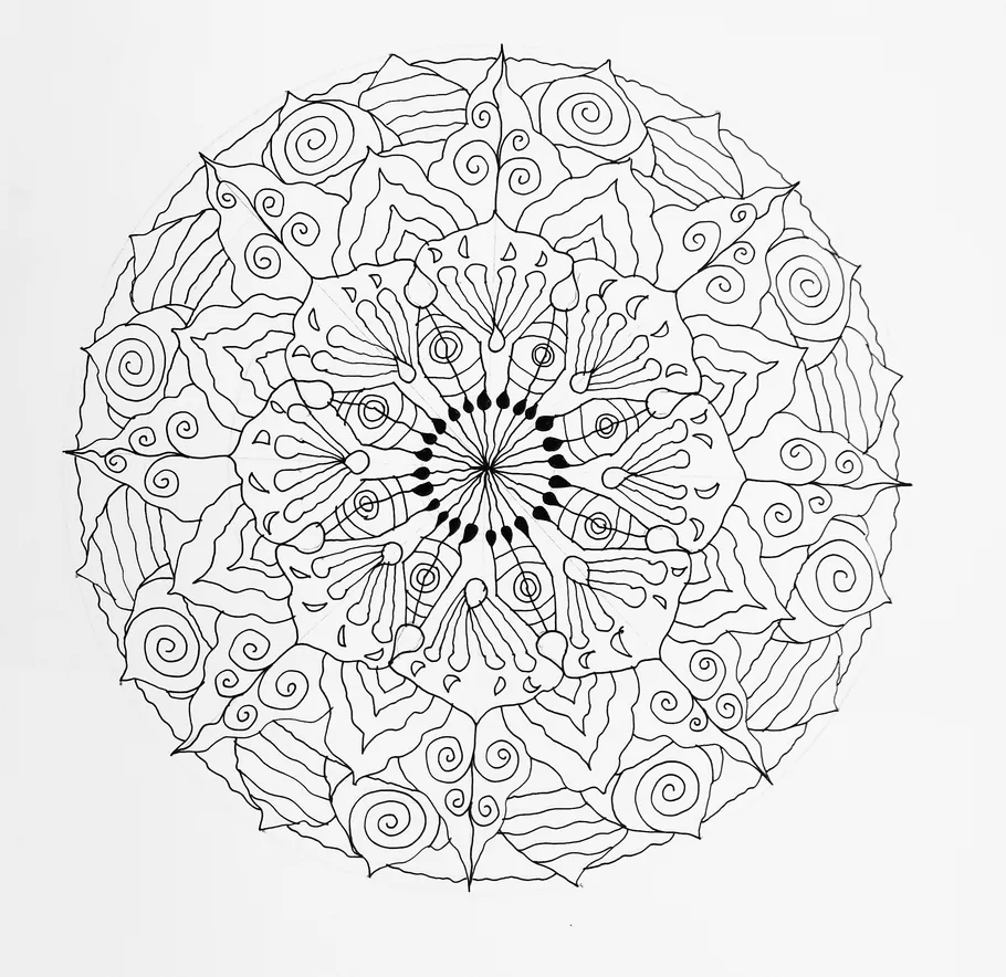 Detailed mandala drawing with intricate patterns.
