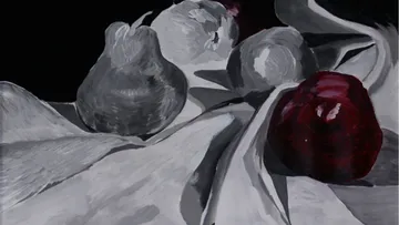 Gray and red fruits on white fabric.