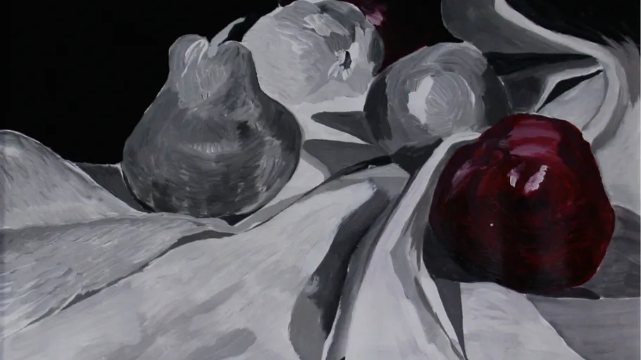 Gray and red fruits on white fabric.