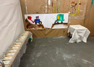 Art room with construction vehicle drawings.
