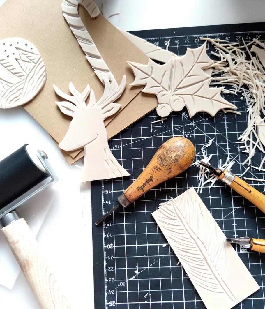 Carved stamps arranged on cutting mat.