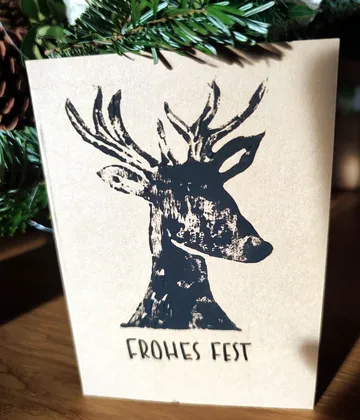 Greeting card with deer illustration and text.