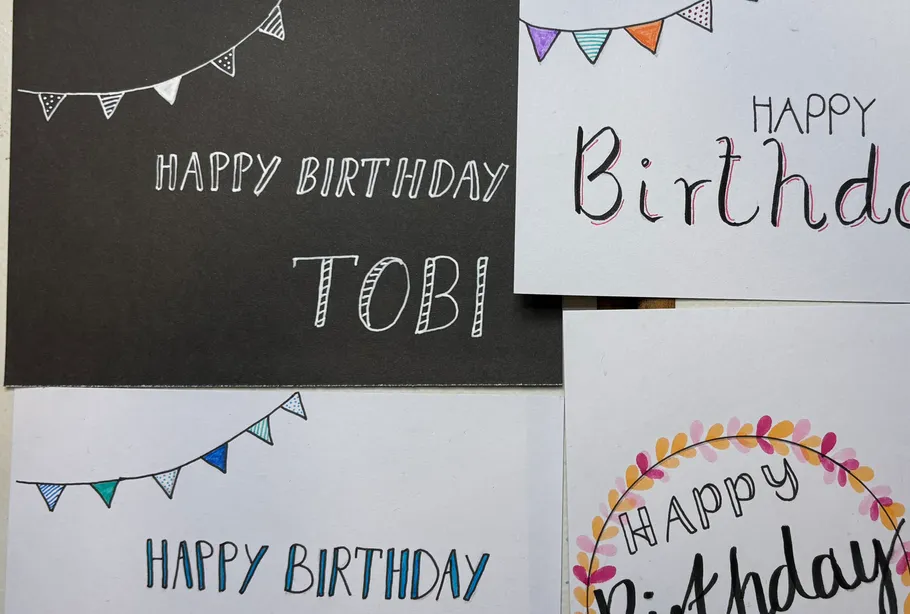 Handmade birthday cards on a table.